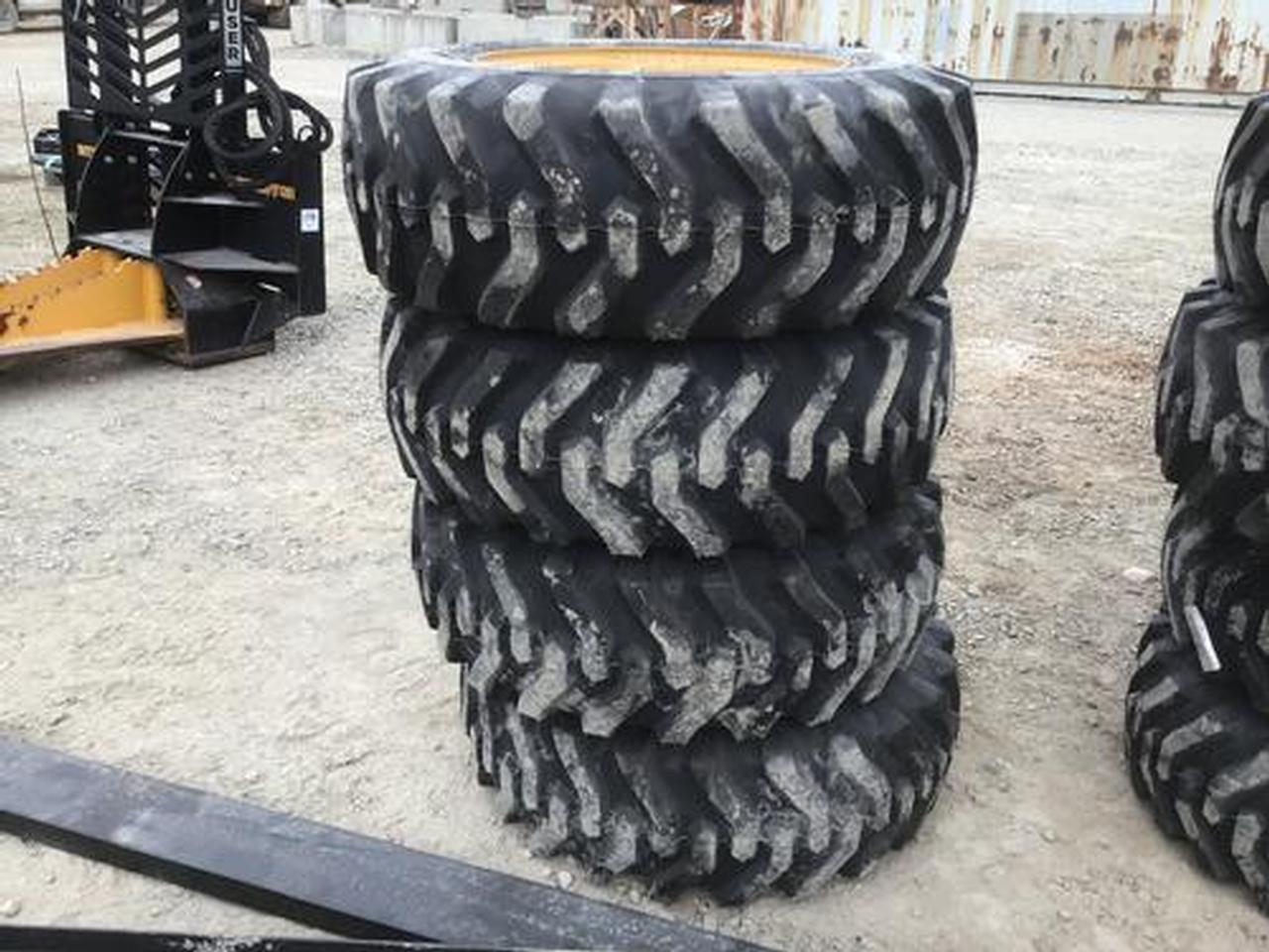 10-16.5 Skid Steer Tires on 8 Lug Rims