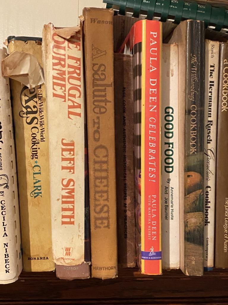 TWO SHELVES OF COOKBOOKS