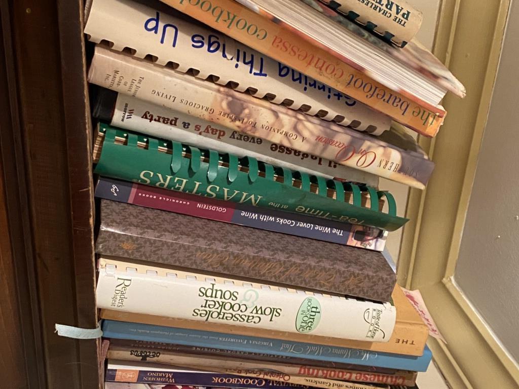 TWO SHELVES OF COOKBOOKS