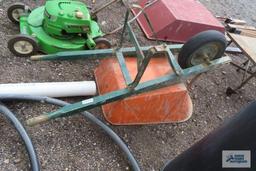 Orange wheelbarrow with pneumatic wheel