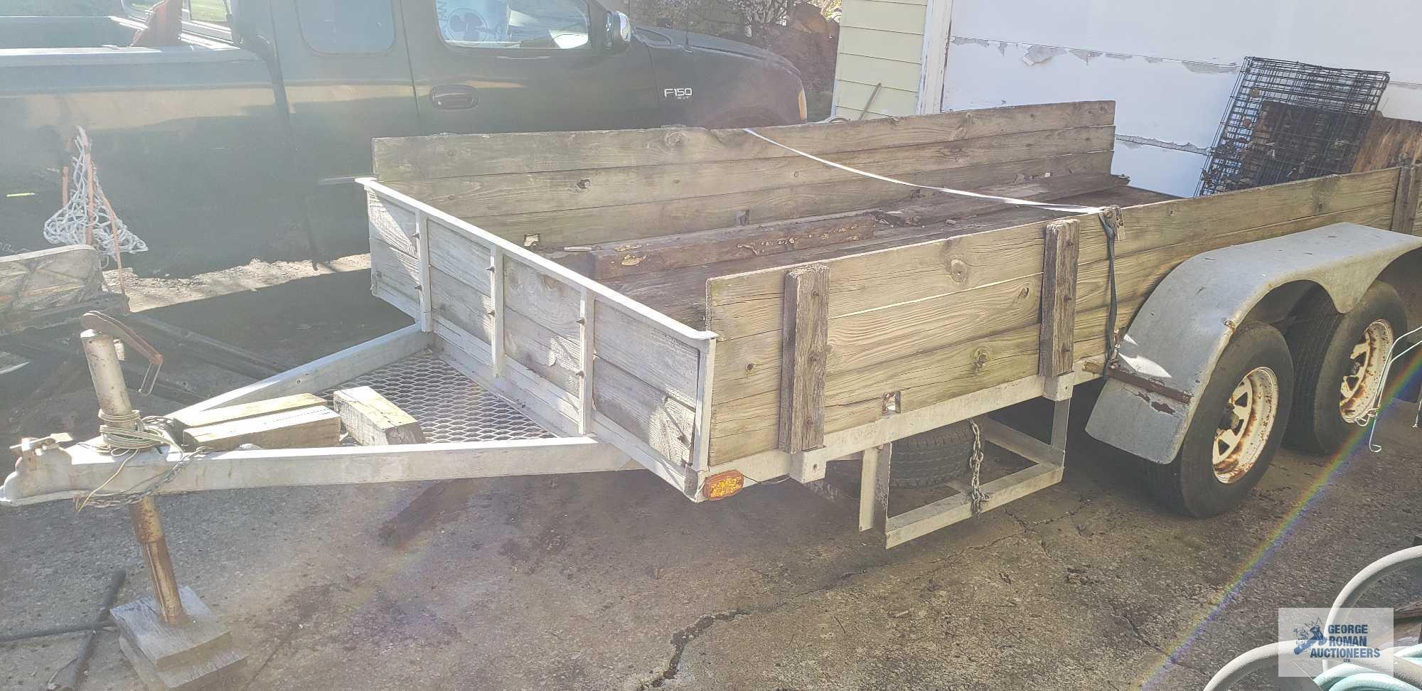 Galvanized shopmade utility trailer with dual 3500 lb axles, measures 14 ft by 5 ft 11 in. It takes