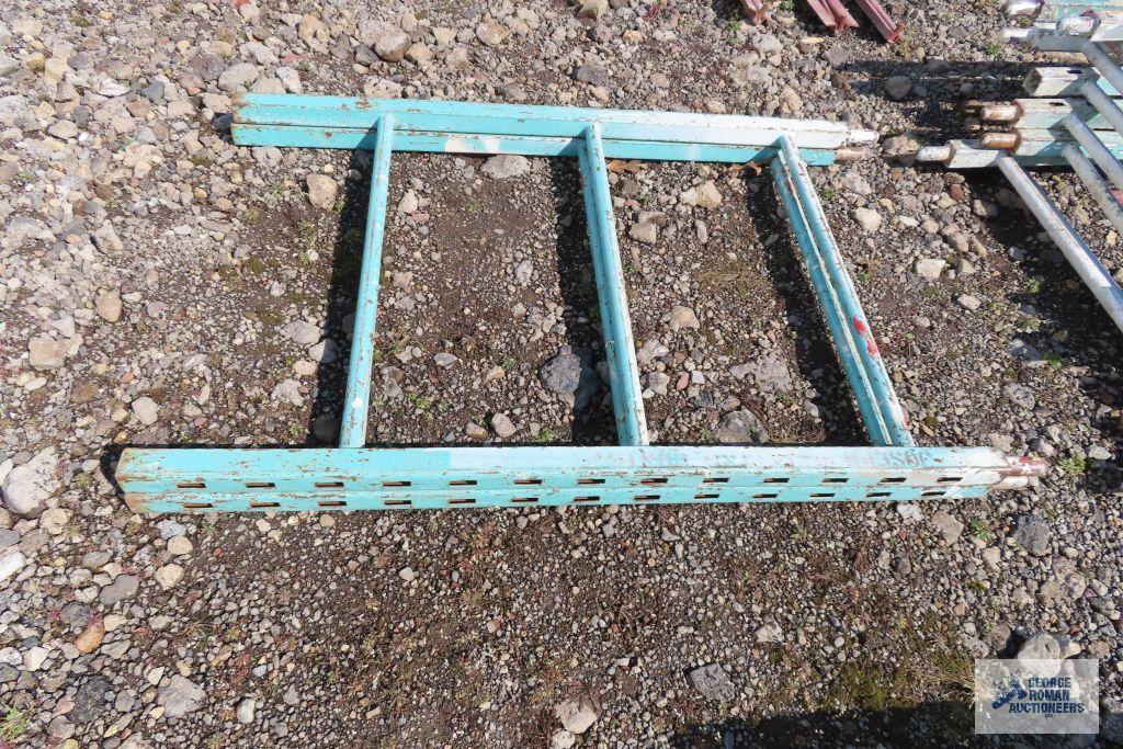 Lot of green roll about scaffolding pieces with boards