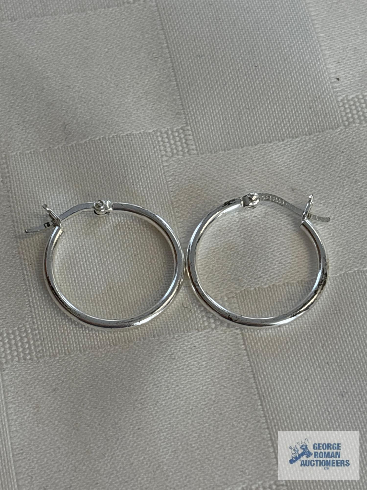 Silver colored hoop earrings, marked 925, approximate total weight is 1.79 G