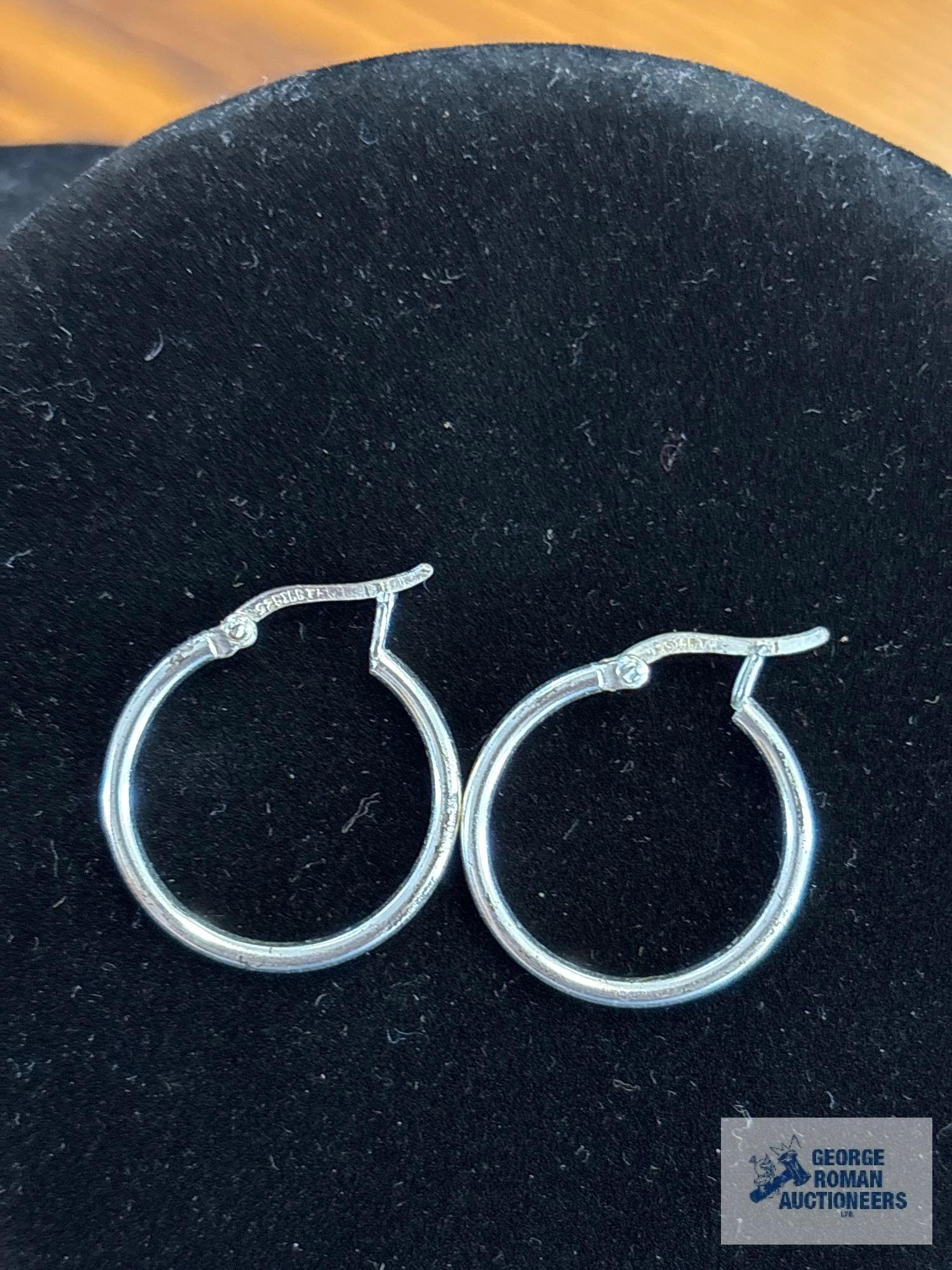 Silver colored hoop earrings, marked 925, approximate total weight is 1.79 G