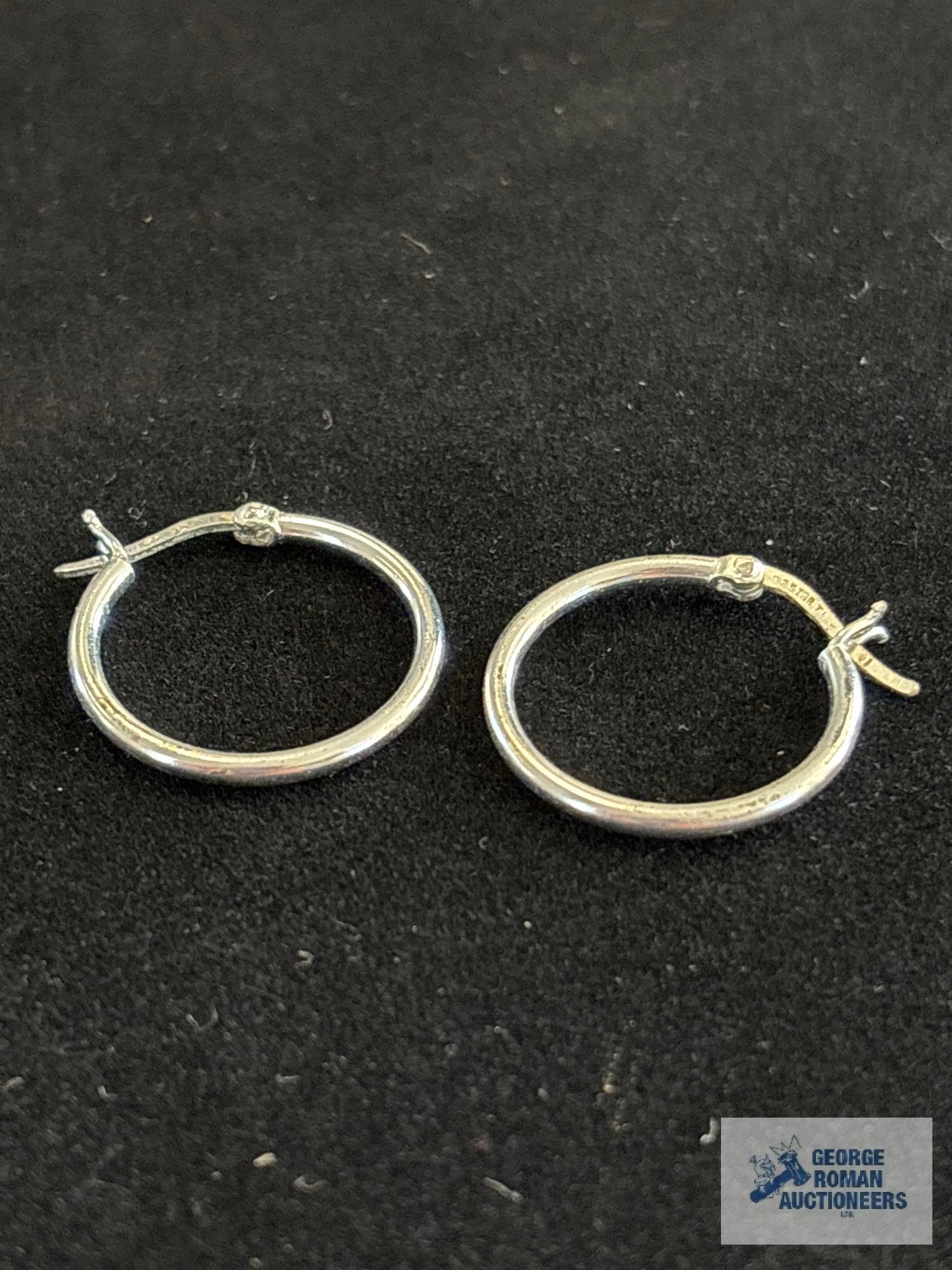 Silver colored hoop earrings, marked 925, approximate total weight is 1.79 G