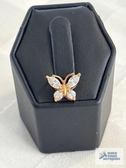 Gold colored butterfly pendant with clear gemstones, marked 925, approximate total weight is 1.26 G