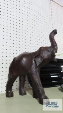 Leather like carved elephant figurine