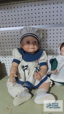 Virginia E. Turner sailor girl doll and other kneeling doll, fingers are broken