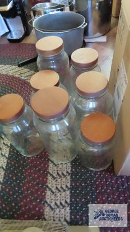 Glass jars with cork type lids and box of assorted drink cups