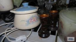 lot of candle holders and candles