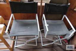 Pair of faux leather chairs with metal frames