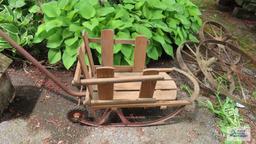 Vintage infant sled with wheels and handle