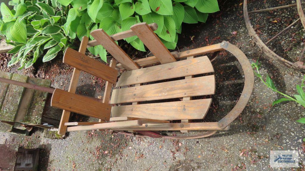 Vintage infant sled with wheels and handle