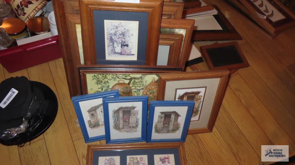 Variety of decorative prints in wooden frames