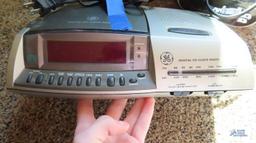GE digital CD clock radio, Sony dream machine, and Sharp alarm clock
