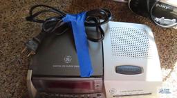 GE digital CD clock radio, Sony dream machine, and Sharp alarm clock