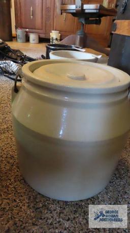 Cream colored handled crock with lid