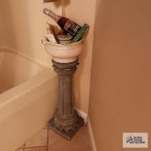 Chamber pot of miscellaneous items on a pedestal