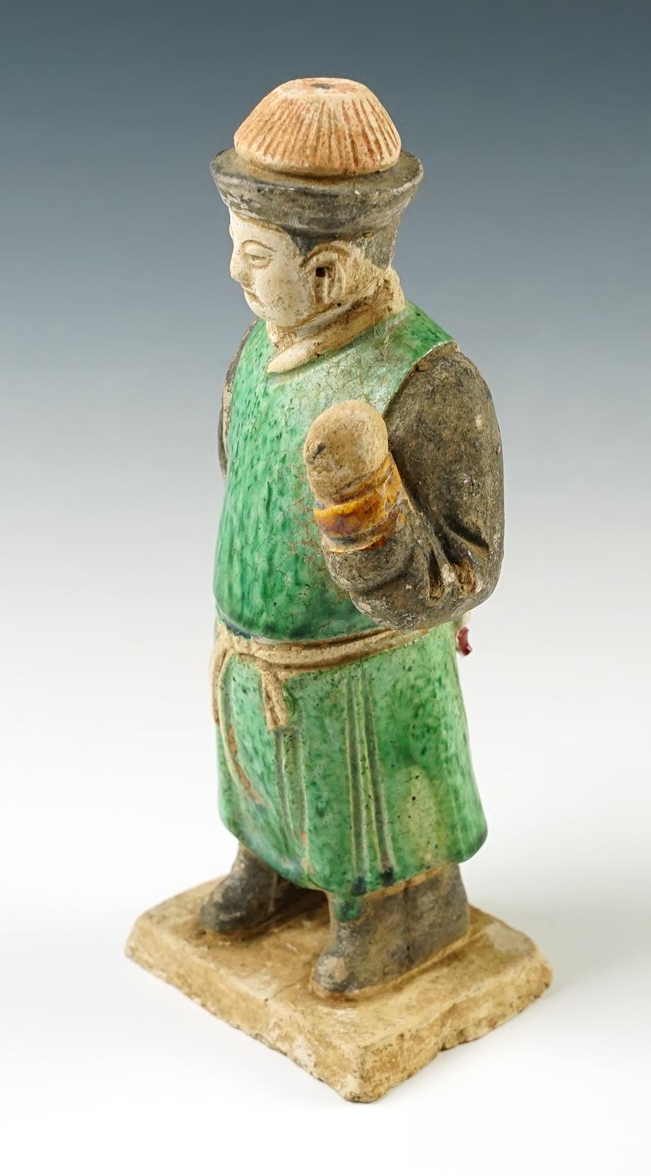 8 " tall Chinese male figure from the Tang Dynasty, cira A.D 618- 907. In excellent condition.