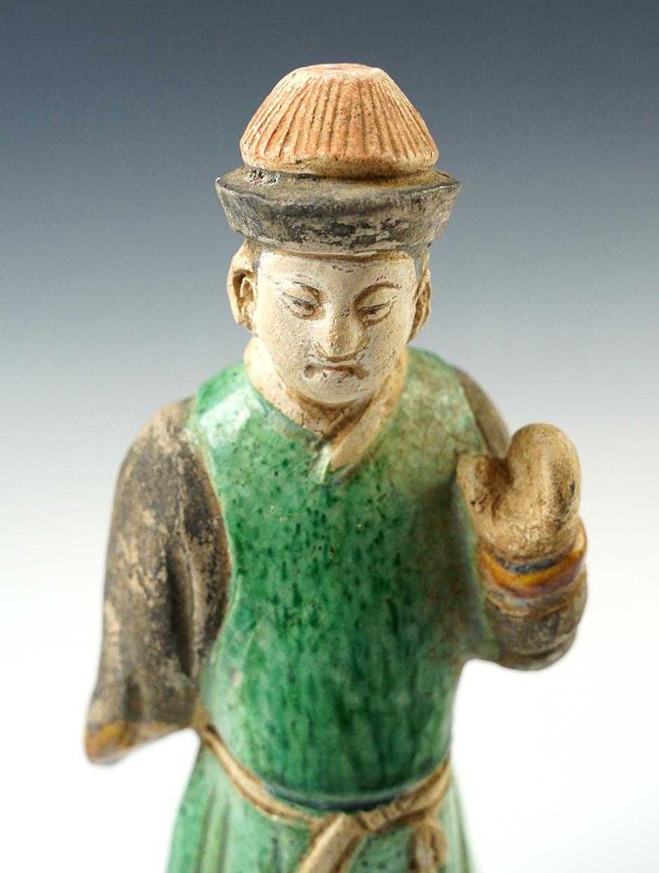 8 " tall Chinese male figure from the Tang Dynasty, cira A.D 618- 907. In excellent condition.