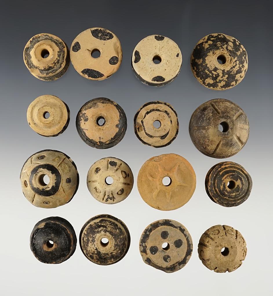 Group of 16 Pre-Columbian spindle whorls recovered in Mexico. Largest is 1 1/4".