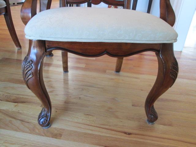 Beautifully Carved Mahogany Finish Dining Table, Armchairs, Side Chairs and Leaves