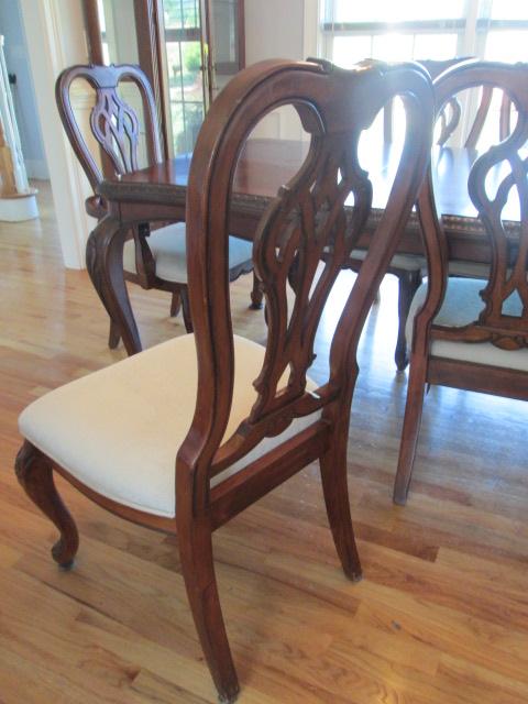 Beautifully Carved Mahogany Finish Dining Table, Armchairs, Side Chairs and Leaves