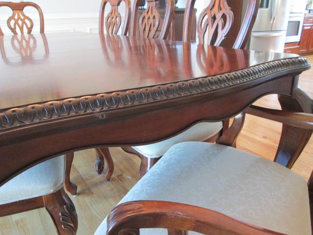 Beautifully Carved Mahogany Finish Dining Table, Armchairs, Side Chairs and Leaves