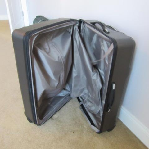 Two Samsonite 360 Turn Rolling Suitcases