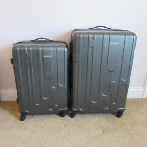 Two Samsonite 360 Turn Rolling Suitcases