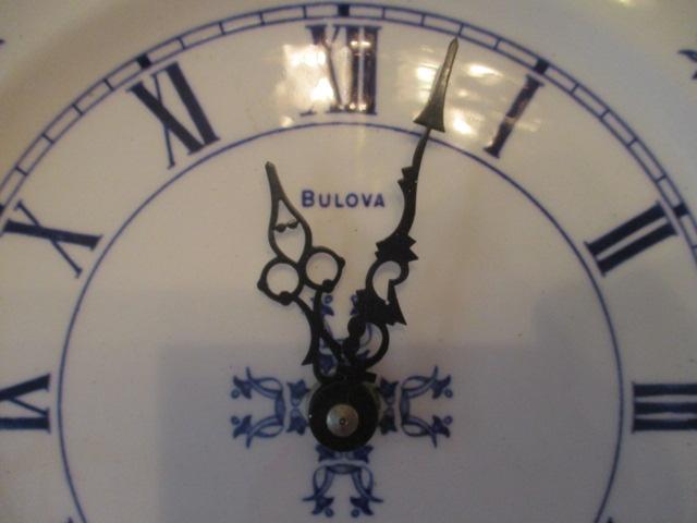 Two Round Blue and White Quartz Plate Clocks