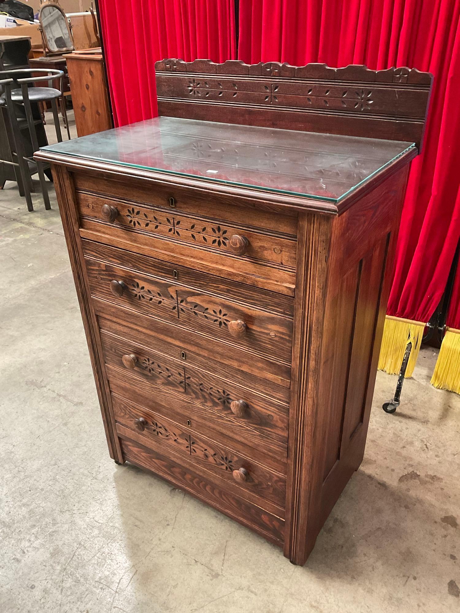 Antique Wooden Wheeled Glass Topped Dresser w/ 4 Drawers & Carved Floral Patterns. See pics.