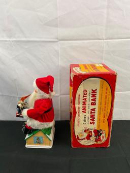 Vintage Noel Decorations Deluxe Animated Battery & Coin Operated Santa Bank. Original Box. See pi...