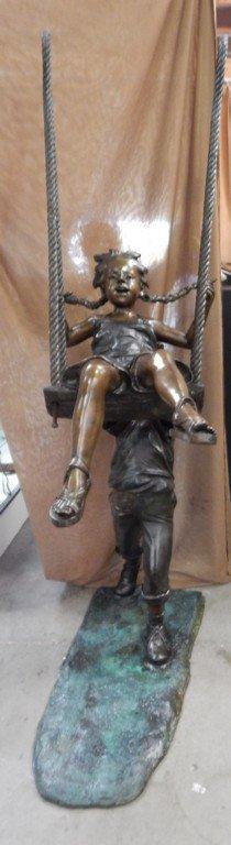 LARGE KIDS SWINGING BRONZE SCULPTURE