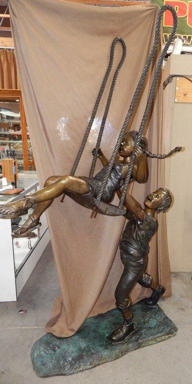 LARGE KIDS SWINGING BRONZE SCULPTURE