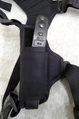 De Santis Model B6 handgun harness holster comes with a pouch to hold two mags. Look up the Model to