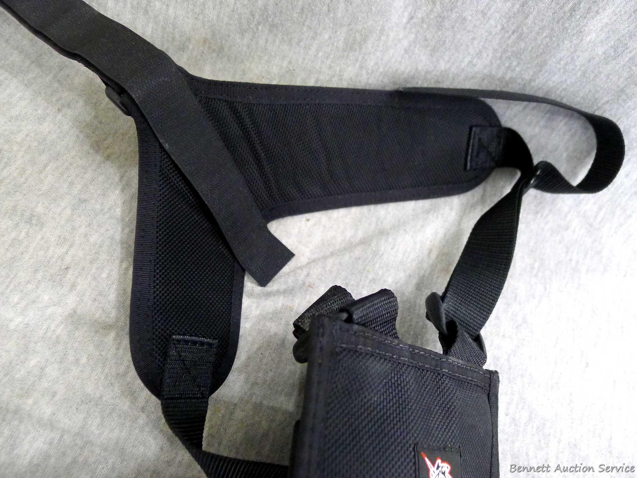 De Santis Model B6 handgun harness holster comes with a pouch to hold two mags. Look up the Model to