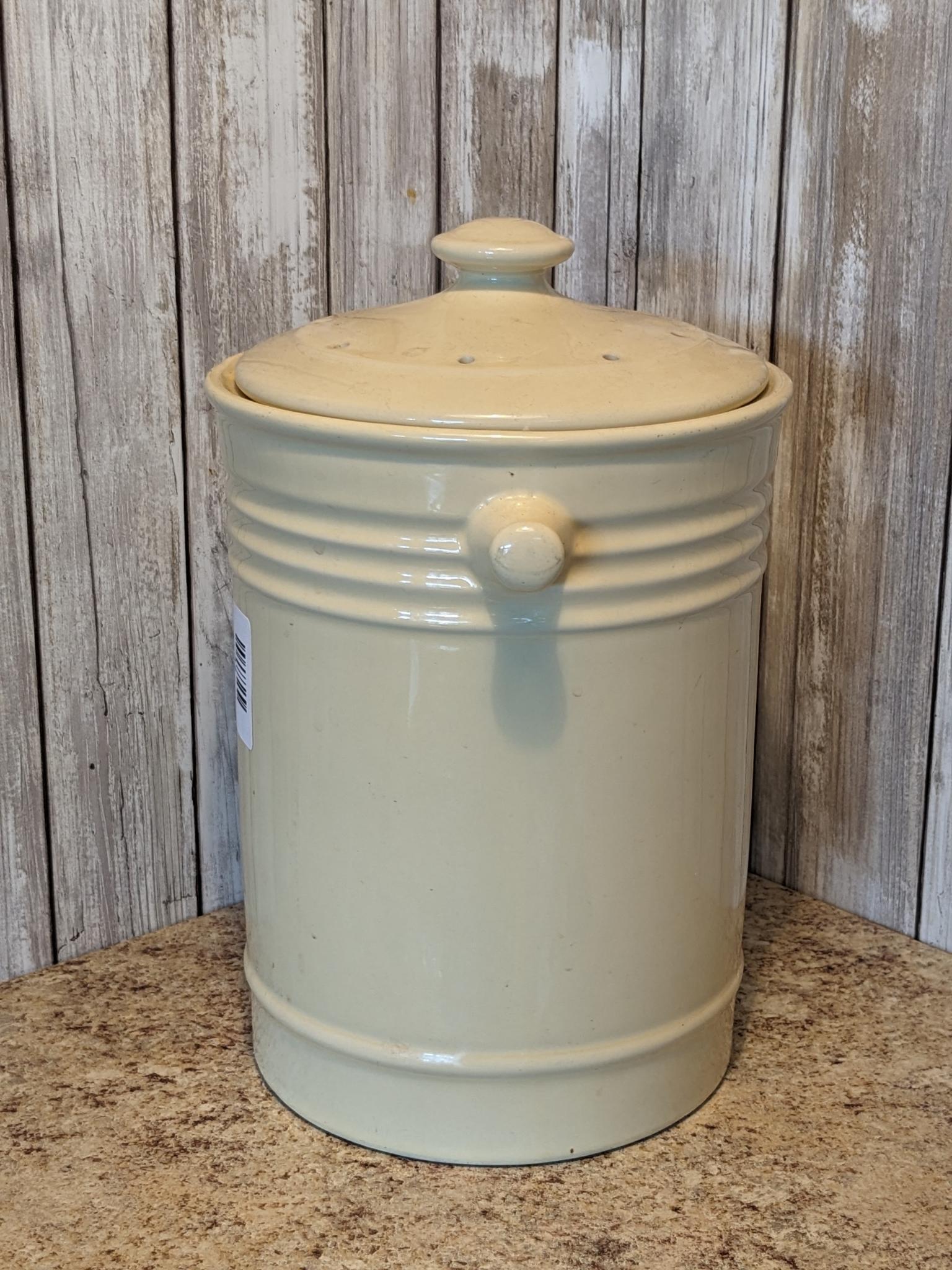 Soft butter yellow ceramic composter stands 11-1/2" to top of lid.