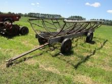 222. SHOP BUILT ROUND BALE FEEDER ON FOUR WHEEL WAGON