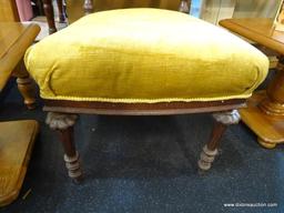 VICTORIAN STYLE ACCENT CHAIR; FEATURES FOUR WOODEN SCROLLED LEGS, UPHOLSTERED IN MUSTARD COLOR