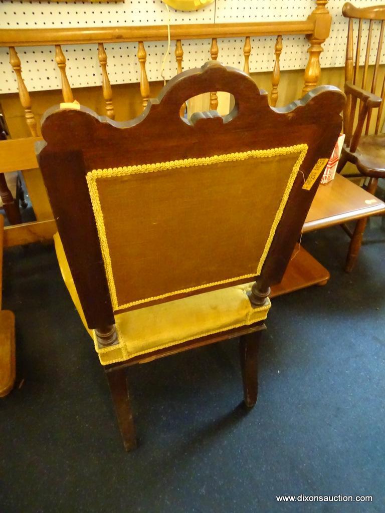 VICTORIAN STYLE ACCENT CHAIR; FEATURES FOUR WOODEN SCROLLED LEGS, UPHOLSTERED IN MUSTARD COLOR