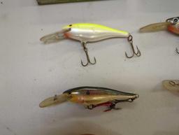 Tackle Box and contents including various fishing lures of similar style. Comes as is shown in