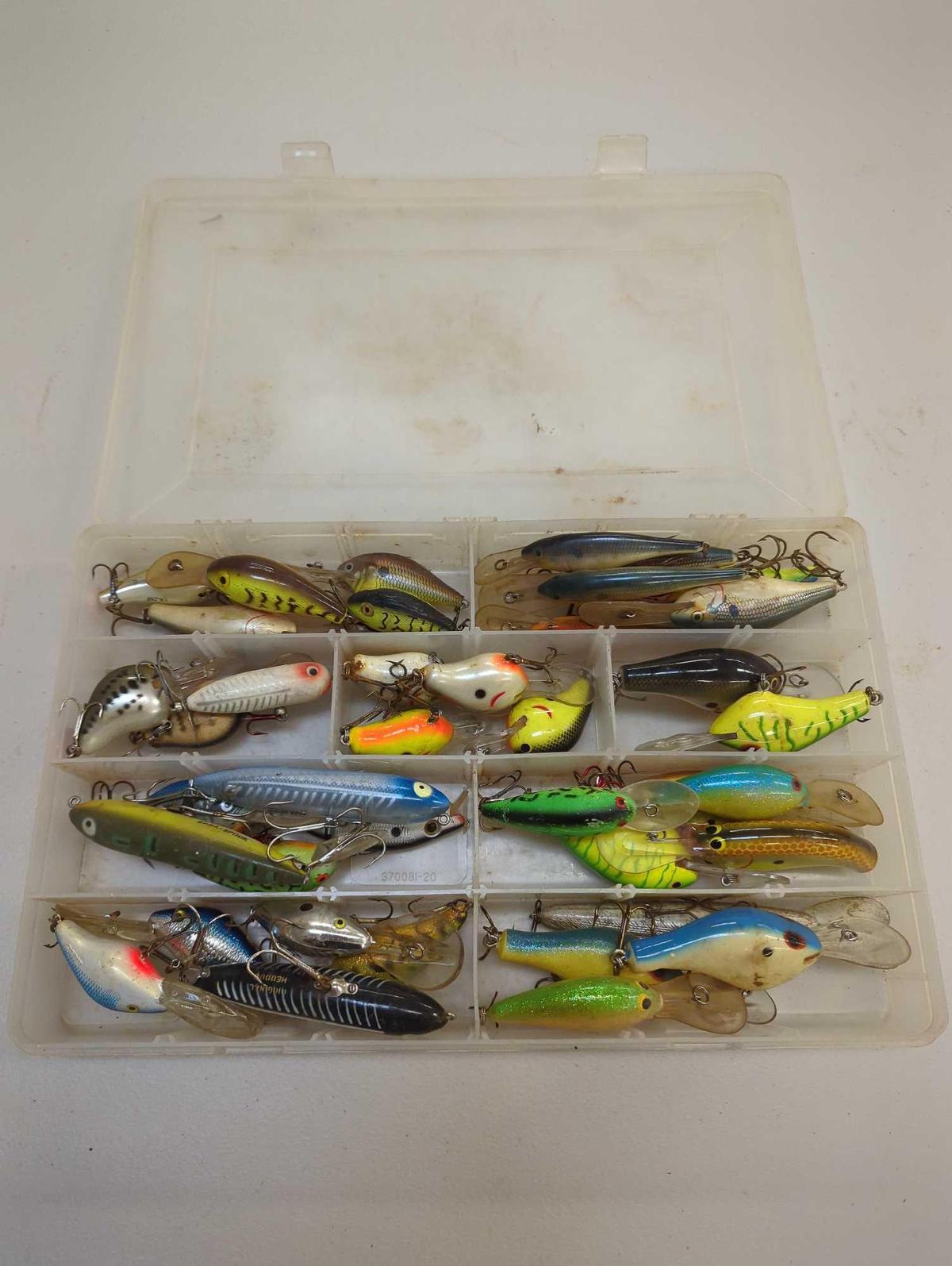 Tackle Box and contents including various fishing lures of similar style. Comes as is shown in