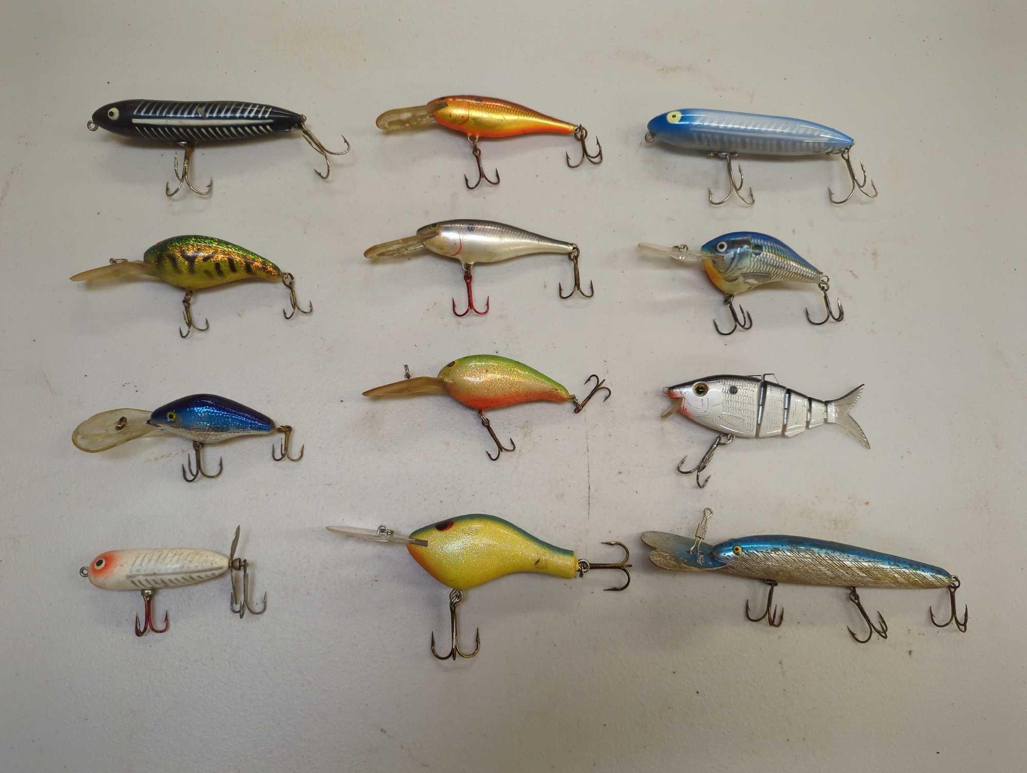 Tackle Box and contents including various fishing lures of similar style. Comes as is shown in