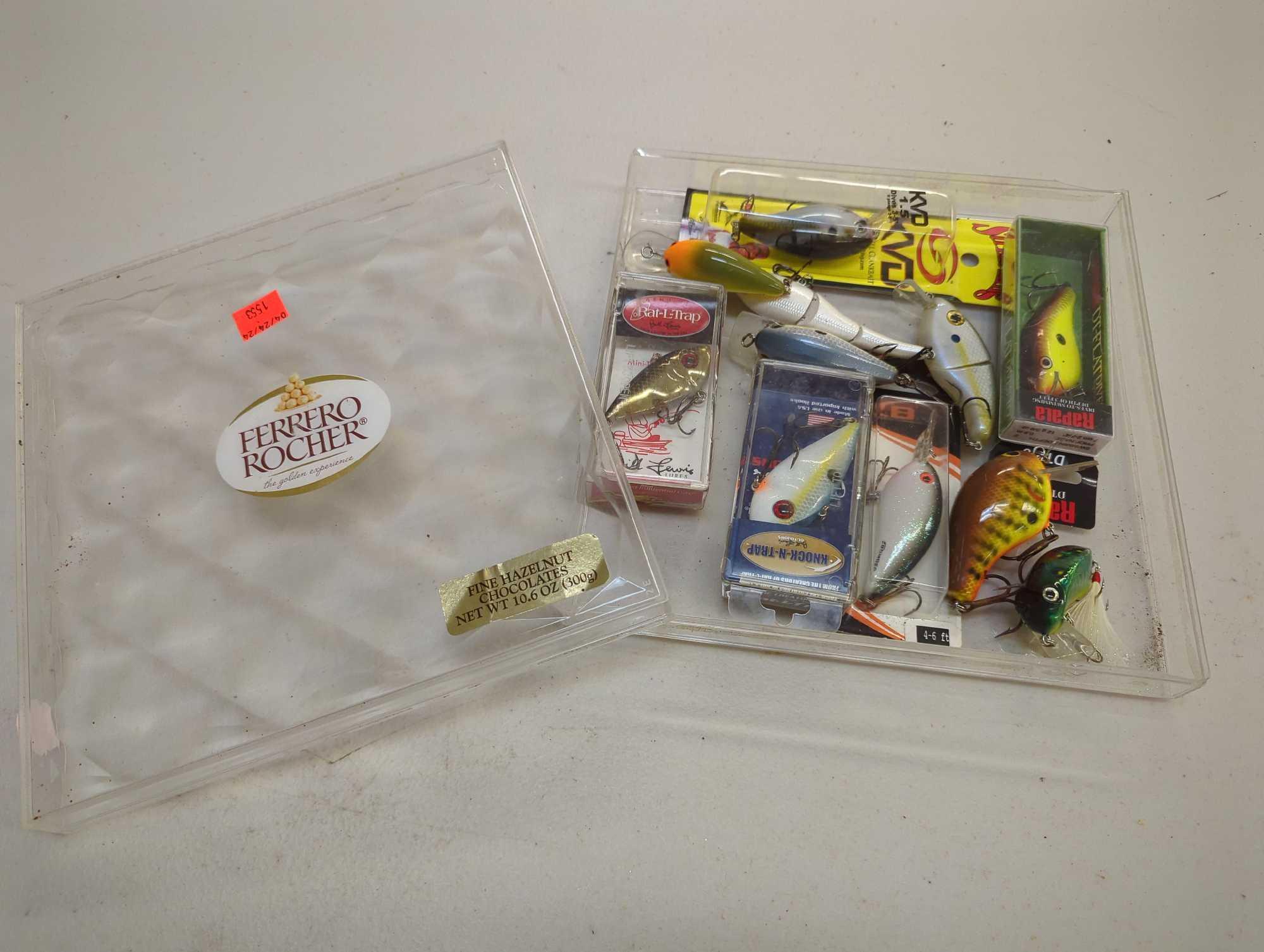 Clear chocolate box of fishing lures of similar style. Comes as is shown in photos. Appears to be