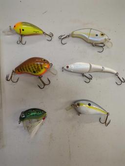 Clear chocolate box of fishing lures of similar style. Comes as is shown in photos. Appears to be