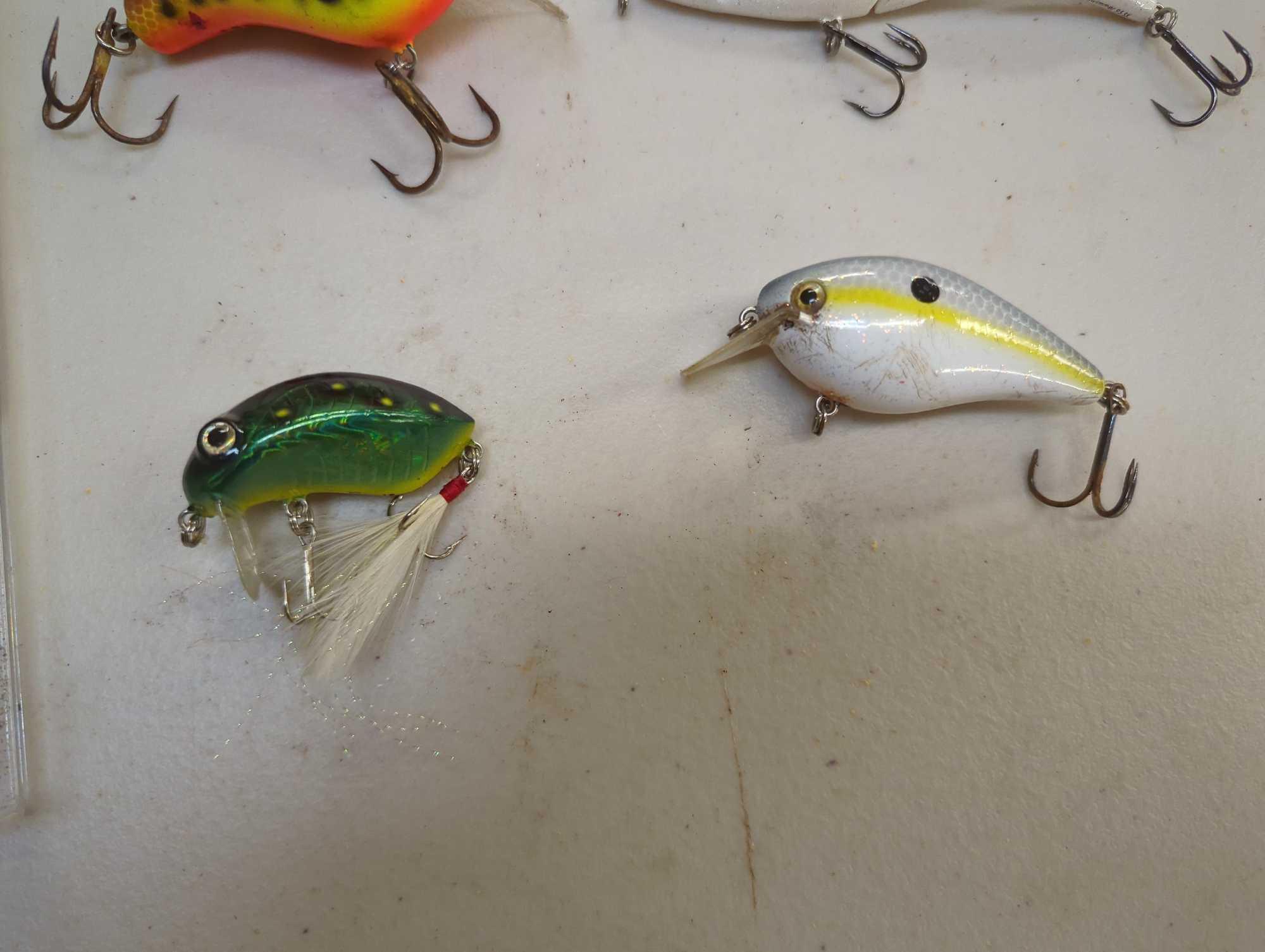 Clear chocolate box of fishing lures of similar style. Comes as is shown in photos. Appears to be