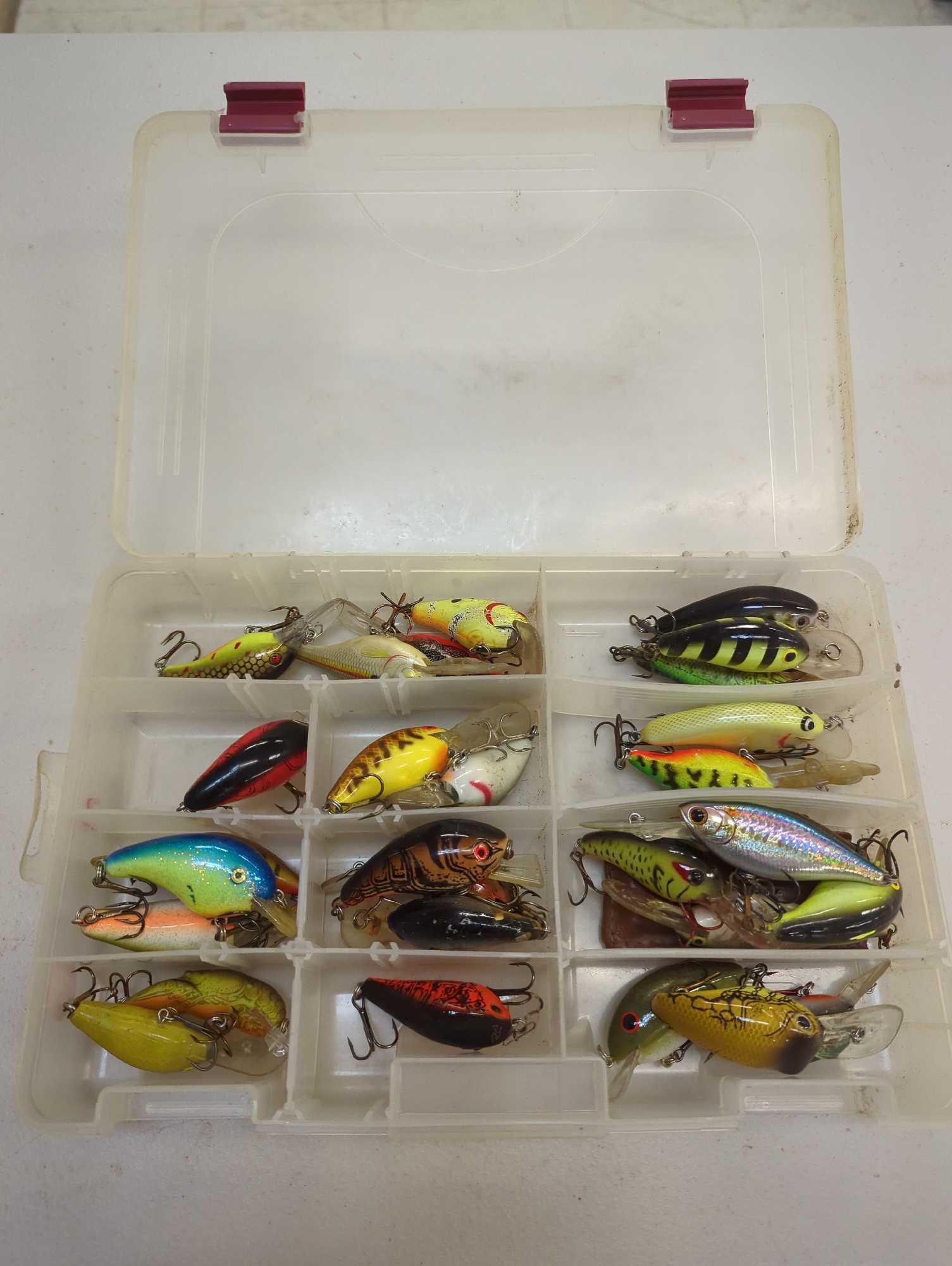 Tackle Box and contents includes fishing lures of similar style. Comes as is shown in photos.