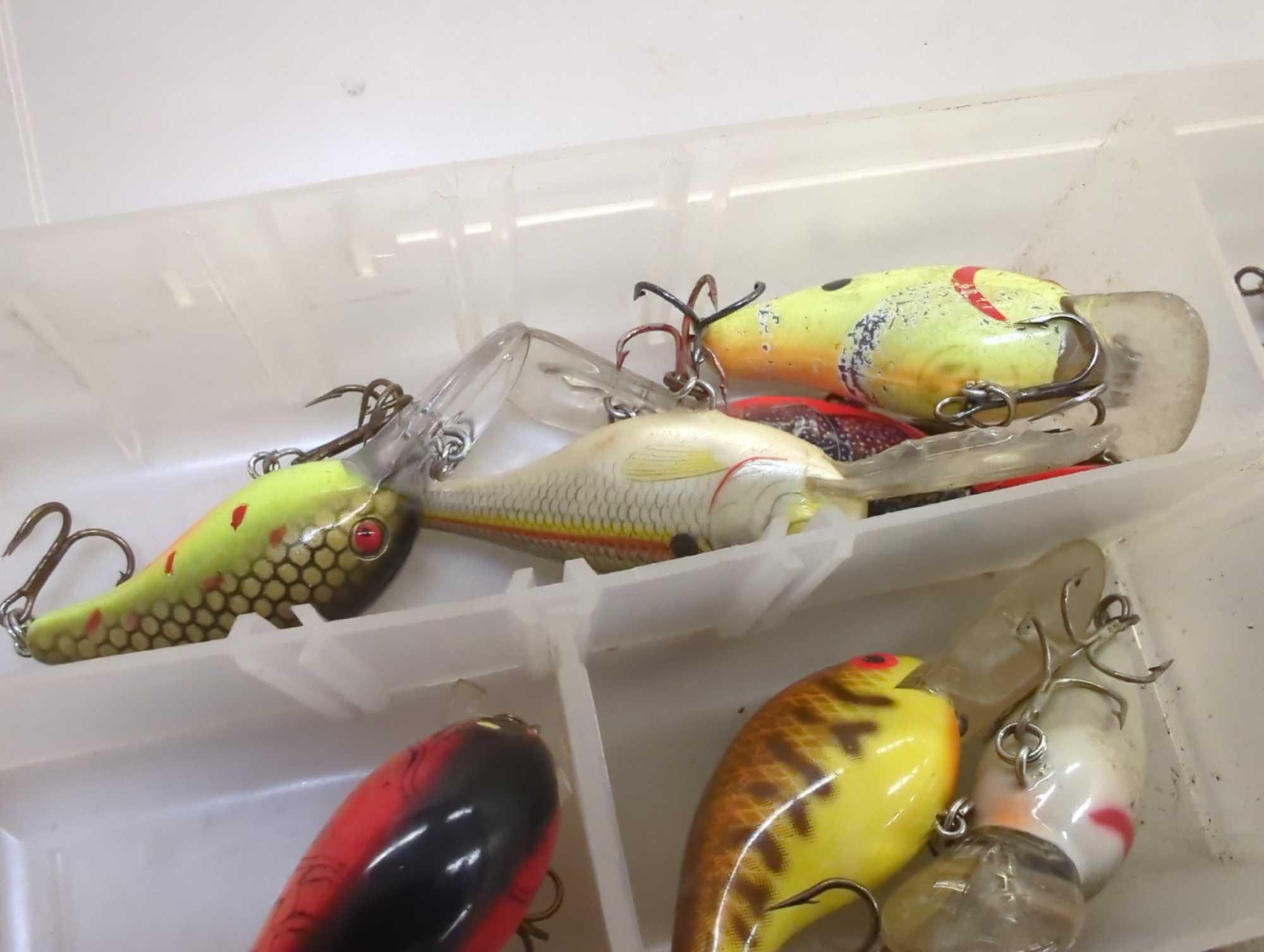 Tackle Box and contents includes fishing lures of similar style. Comes as is shown in photos.