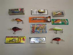 Container and contents including various fishing lures of similar style. Comes as is shown in